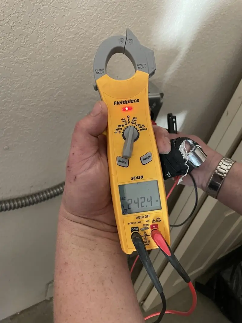 Voltage testing with clamp meter during Generator Installation in Plant City